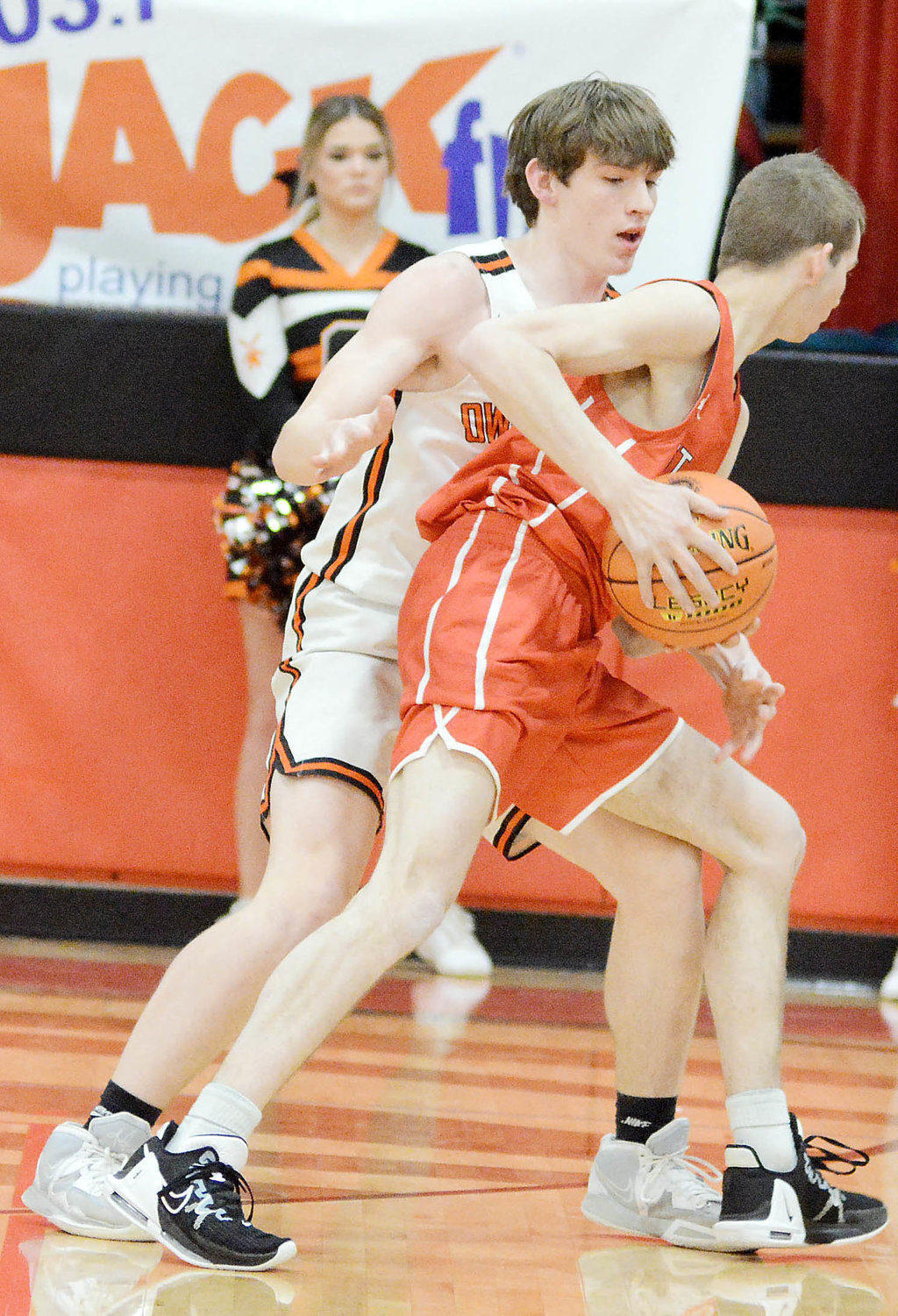 Layne Evans closely guards a St. James Tiger ball handler during first-round action last Monday at the MSHSAA Class 4, District 3 Boys Basketball Tournament hosted by St. James High School.